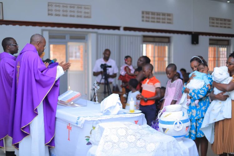 Children who were born prematurely receive a blessing during Mass led Fr. Surivenus Nungwa the Archdiocese of Mbarara Vicar General as Holy innocents children's hospital celebrates World Prematurity Day